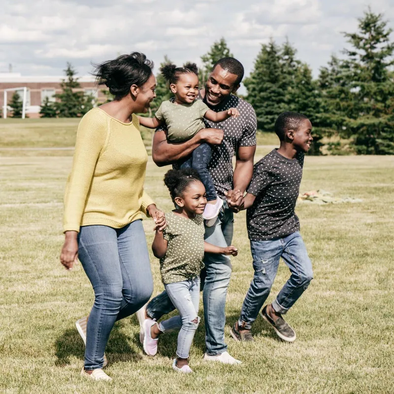 A family playing together in a park