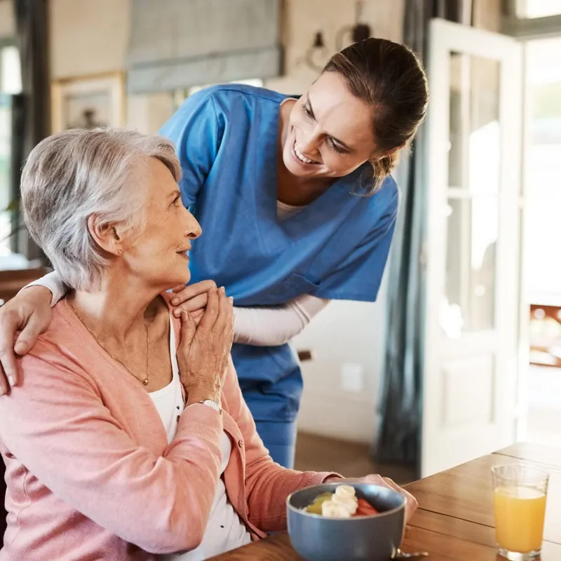 A caregiver sharing a moment with a senior